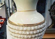 qizil suyu ile iwlenmiw guldan