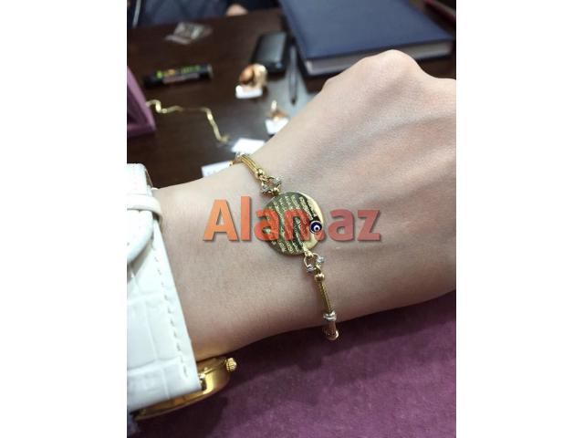 Qizil 585 prob qolbaq pandora  modeldir. Klon uzerinde ayetel kursi qeyd olunub.